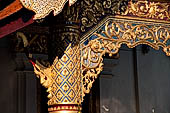 Chiang Mai - The Wat Phra Singh temple. The large Viharn Luang (main prayer hall) with an intricately carved front.  